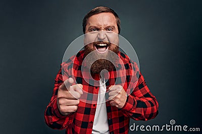 Man threatening person with angry outraged expression, lose temper standing distressed, pointing camera accuse someone, blame Stock Photo