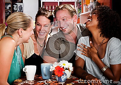 Man with three pretty women in coffee house Stock Photo