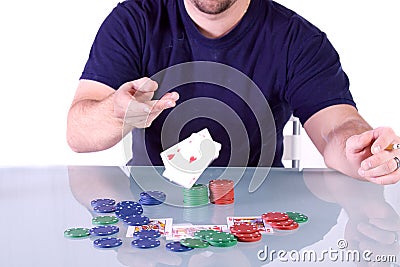 Man Throwing Cards on the Table in Texas Hold'em Stock Photo