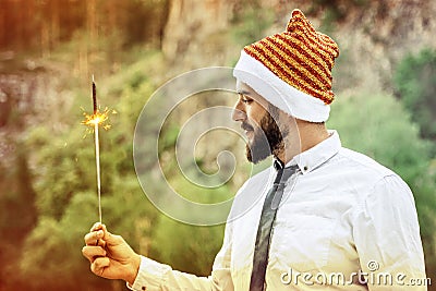 Man with a tie and a hat with sparkler Stock Photo