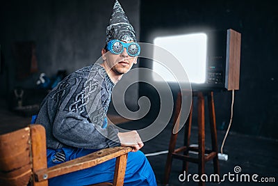 Man in tinfoil helmet and hypnotizing glasses, UFO Stock Photo