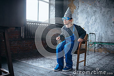 Man in tinfoil helmet and hypnotizing glasses, UFO Stock Photo