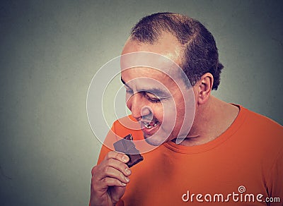 Man tired of diet restrictions craving sweets chocolate Stock Photo