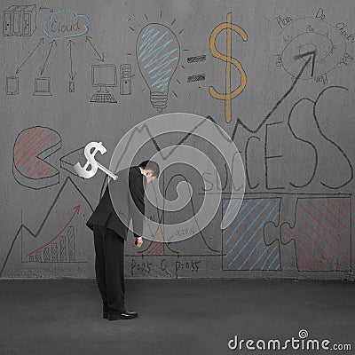 Man tired with winder and business doodles on wall Stock Photo
