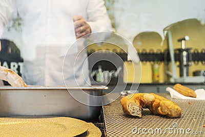 Man to cook Portuguese delicacy knew by farturas. Editorial Stock Photo