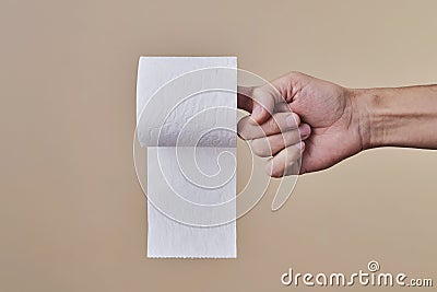 Man with a toilet paper roll in his hand Stock Photo