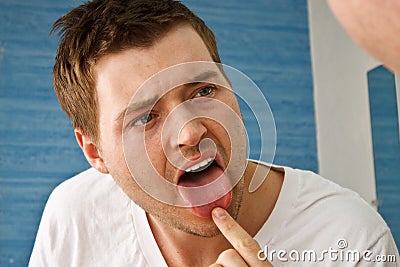 Man Tongue Mirror Stock Photo