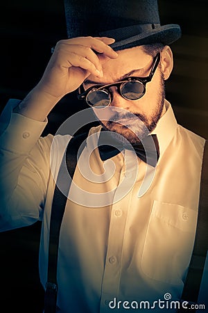Man with Top Hat and Steampunk Glasses Retro Portrait Stock Photo