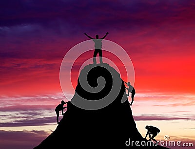 Man on top of the mountain and the other people to climb up. Stock Photo