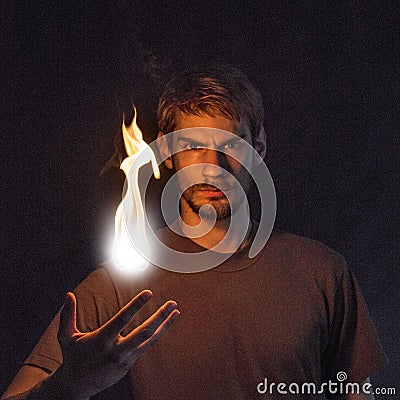 Man Tossing Fire Ball Stock Photo