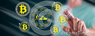 Man touching a bitcoin mining concept Editorial Stock Photo