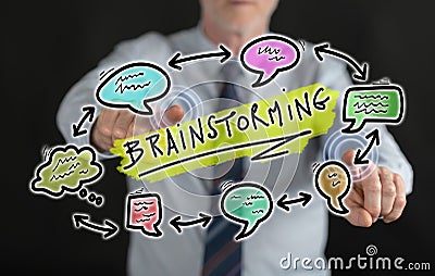 Man touching a brainstorming concept on a touch screen Stock Photo