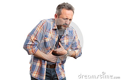 Man touching stomach with nauseous expression Stock Photo