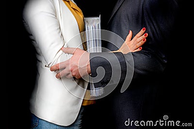 Man touching woman`s elbow - sexual harassment in office Stock Photo