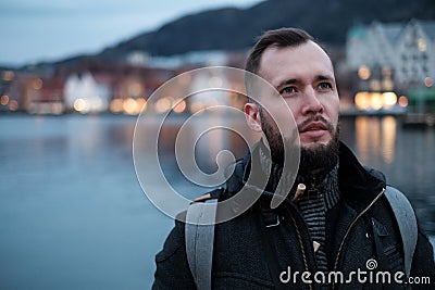 Man tourist against Tyskebryggen in Bergen, Norway Stock Photo