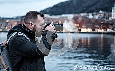 Tourist with camrea against Tyskebryggen in Bergen, Norway Stock Photo