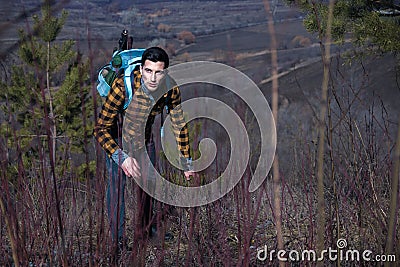 Man tourist with fear on face into the wild in the dark. danger in mountains Stock Photo