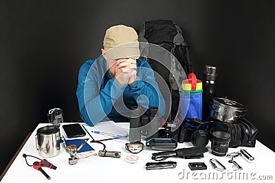 Man a tourist makes a plan for a hike in nature Stock Photo