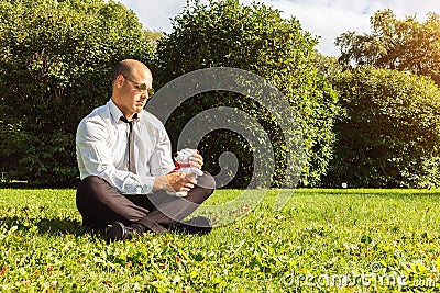 Man toy bear businessman loneliness sad handsome holds in hands Stock Photo