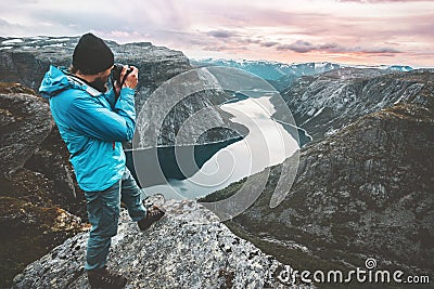 Man travel photographer taking photo landscape in Norway Stock Photo