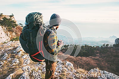 Man Traveler with backpack hiking mountains Stock Photo