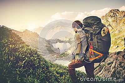Man Traveler with big backpack mountaineering Travel Lifestyle concept Stock Photo