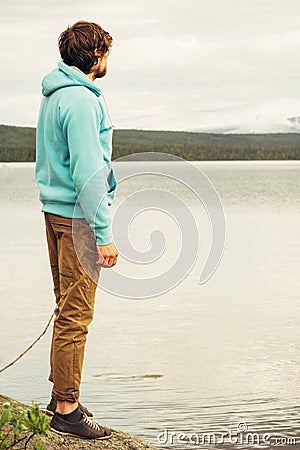 Man Traveler walking alone outdoor Lifestyle Travel Stock Photo