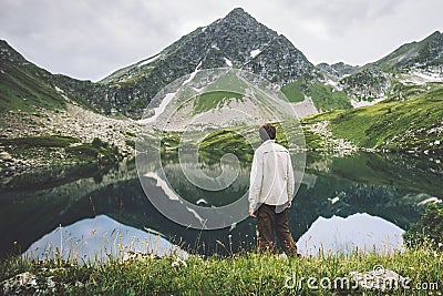 Man traveling alone looking at view adventure vacations Stock Photo