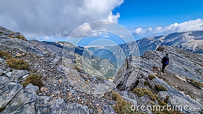 Man trekking on mystical hiking trail leading to Mount Olympus Mytikas, Skala, Stefani in Mt Olympus National Park Stock Photo