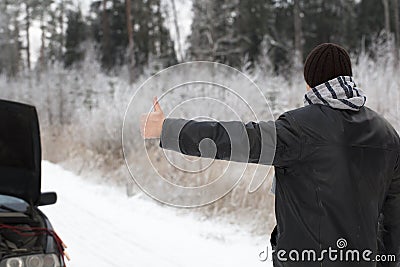 Man tries to stop a car Stock Photo