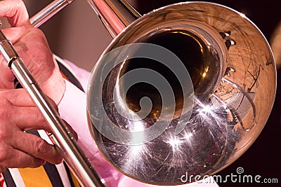 A man on a trombone plays jazz or other music. Stock Photo