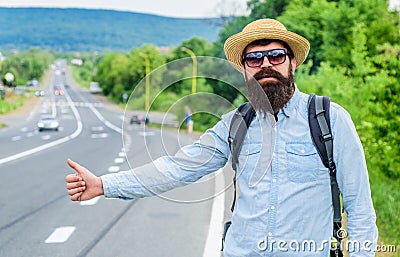Man try stop car thumb up. Travel by autostop. Hitchhiking one of cheapest ways traveling. Hitchhikers can meet lot of Stock Photo