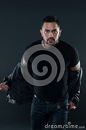 Man in tshirt undress leather jacket. Bearded man with serious face. Fashion macho in casual style clothes. Confidence Stock Photo