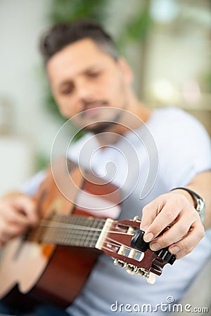 man tuning gitar Stock Photo
