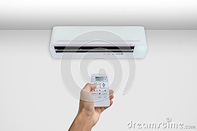 Man turning on the air conditioner Stock Photo