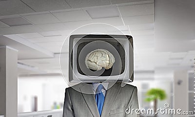 Man with TV instead of head . Mixed media . Mixed media Stock Photo