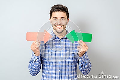 Man with two arrows pointing to the right and left Stock Photo