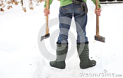 Man with two axes, rear view, lower torso Stock Photo