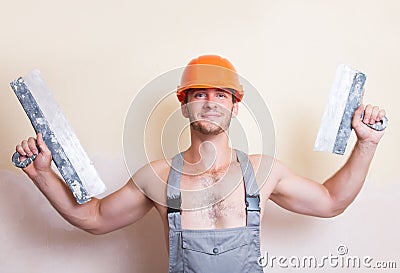 Man with two spatulas in hand Stock Photo