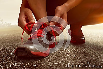 Man tying running shoes Stock Photo