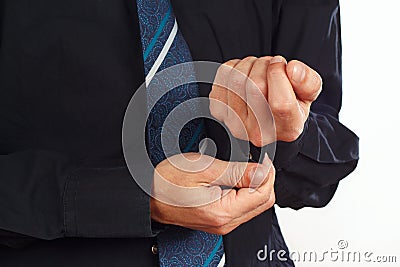 Man unbuttons his sleeve black shirt closeup Stock Photo