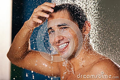 Man under a shower Stock Photo