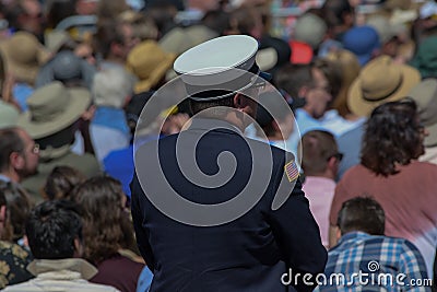 Man in uniform stands in crowd at 20th Annual Lake Tahoe Summit 1 Editorial Stock Photo