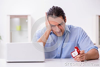 Young man in unrequited love concept Stock Photo