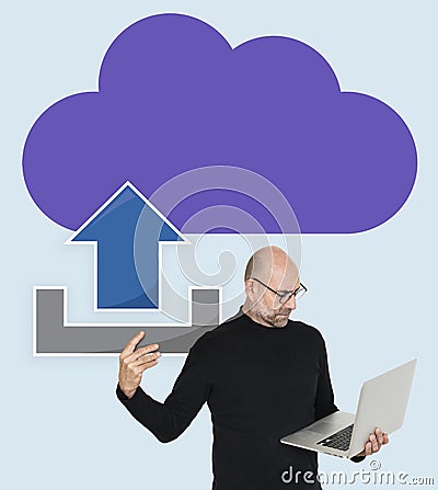 Man uploading data to online cloud storage Stock Photo