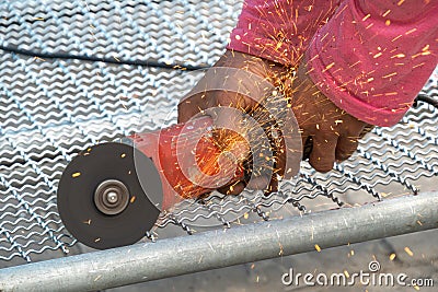 Man used angle grinder without cover guard cutting metal Stock Photo