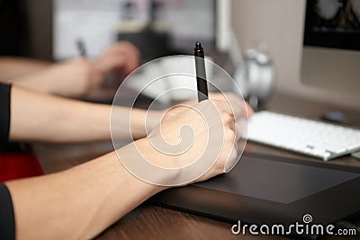 Man uses graphics tablet. Stock Photo