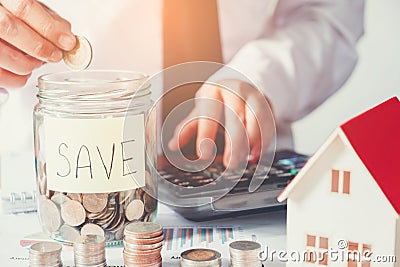 Man using calculator Save money for home cost Stock Photo