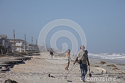 Man using detector to locate treasure Editorial Stock Photo