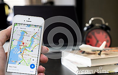 A man using google maps for business travel. Editorial Stock Photo